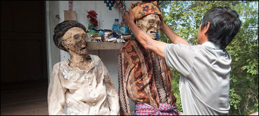 Villagers dig up bodies of dead relatives and give them makeover in bizarre ritual