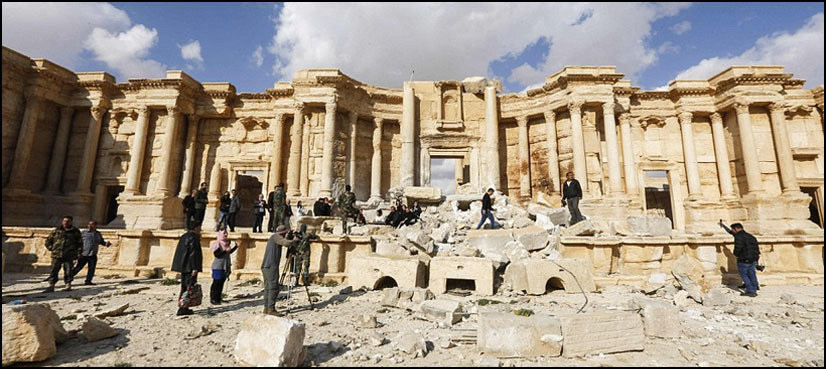 Atop Palmyra's damaged theatre, Syrian musicians sing of return
