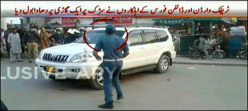 Lahore Traffic Warden suspended for kicking SUV car
