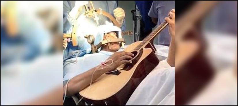 Man plays guitar during brain surgery