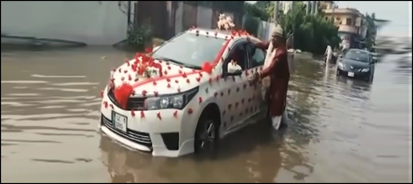VIDEO: ‘Dulha’ in Gujranwala stuck in rainwater, wades thru water to reach his wedding