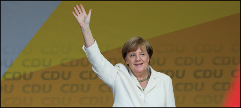 Merkel has no regrets over refugee policy despite political cost