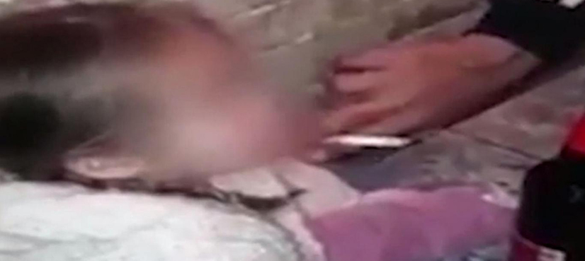 VIDEO: Toddler forced to smoke cigarette, drink beer by teenage parents