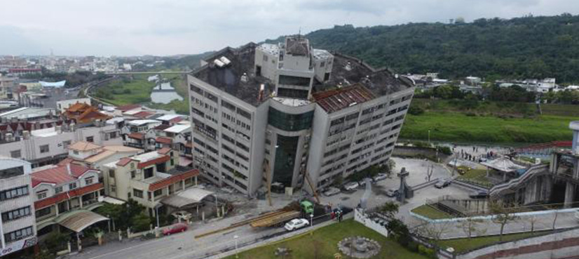 Rescuers scour tilting buildings after Taiwan quake kills seven