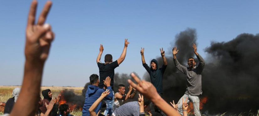 Israeli troops wound dozens on Gaza border as Palestinians bury dead from earlier violence