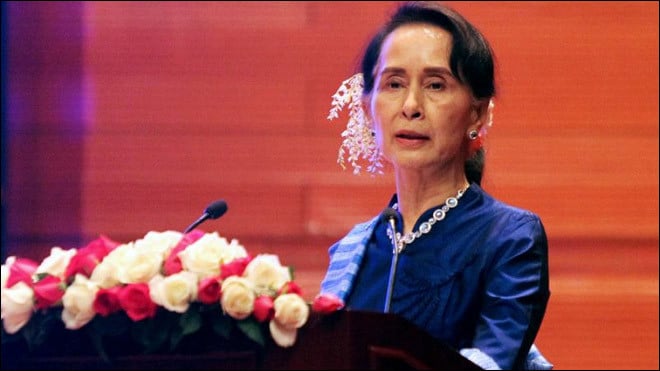 Suu Kyi defends court decision to jail journalists