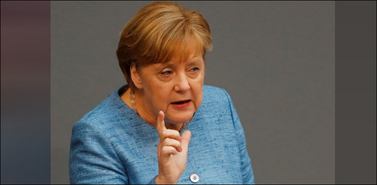 Merkel defends nuclear deal, Iran says won't 'surrender' to US