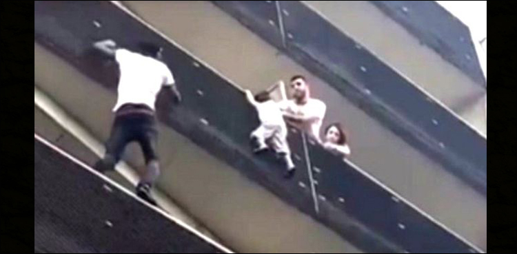 'Spider-Man' of Paris climbs four storeys to rescue dangling child
