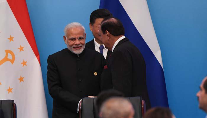 President Mamnoon, PM Modi shake hands at SCO Summit