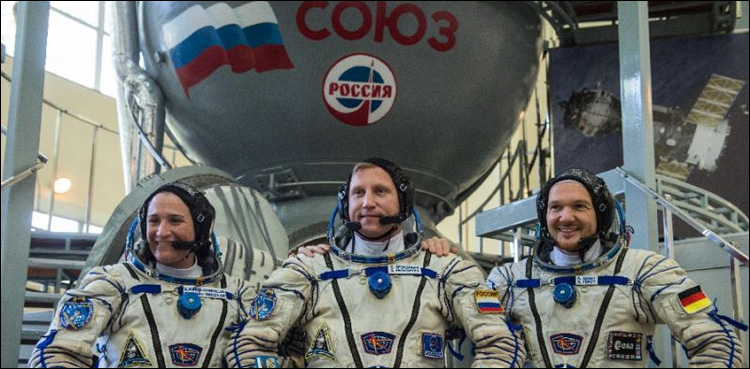Trio reach Earth from ISS with football slated for World Cup
