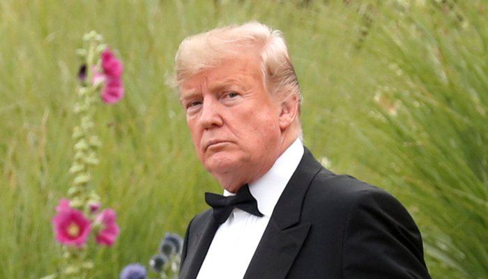 Trump threatens to yank clearances from ex-officials