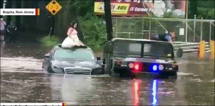 Video: Cop rescues bride from wedding day flood