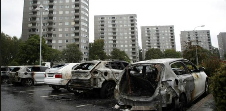 Masked vandals torch dozens of cars in Sweden