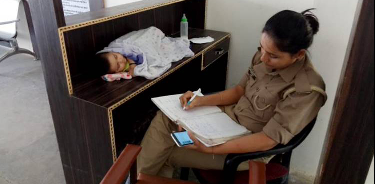 Indian woman constable transferred after her photo with baby at work went viral