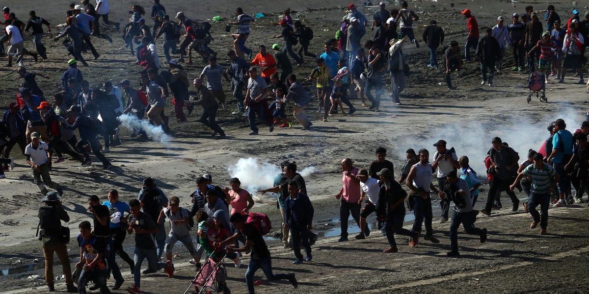 U.S. fires tear gas into Mexico to repel migrants, closes border gate for several hours