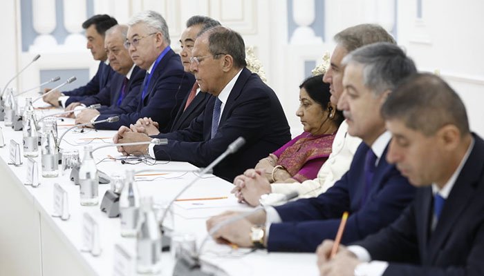 Indian FM Swaraj sits next to Qureshi during SCO meeting