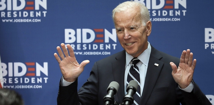 Blasting Trump, Biden pledges global summit on democracy