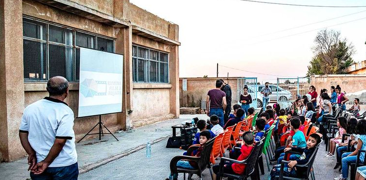Mobile cinema brings movie magic to Syrian children