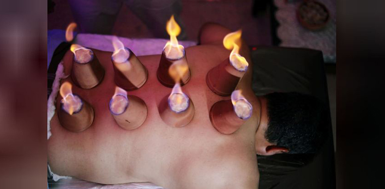Egyptian masseur plays with fire to ease muscle pain