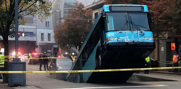 Bus falls into massive sinkhole in Pittsburgh