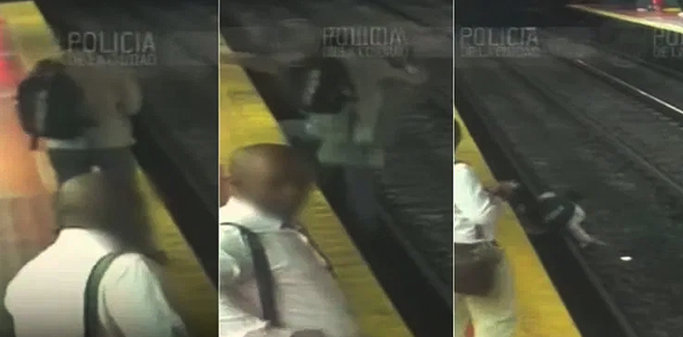 WATCH: Man distracted by phone falls on rail track