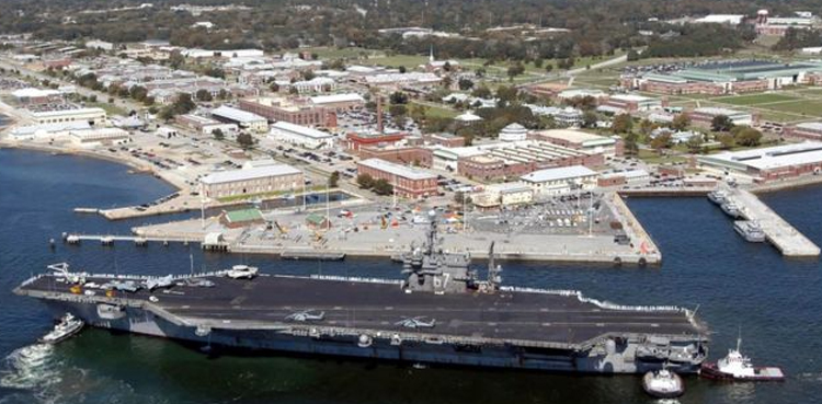 Air force trainee kills three at US navy base in Florida