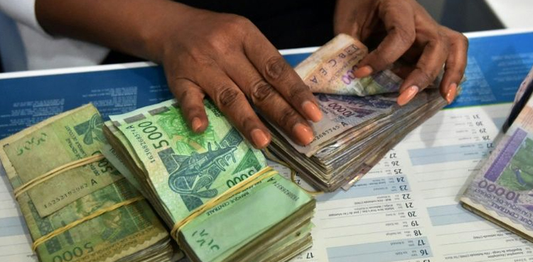 West African nations rename common currency, sever its links to France