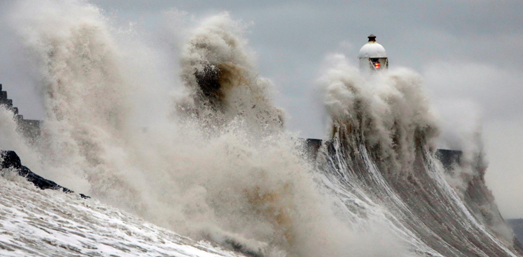 Cyclone Dennis, with 100 feet high waves, lashes the UK