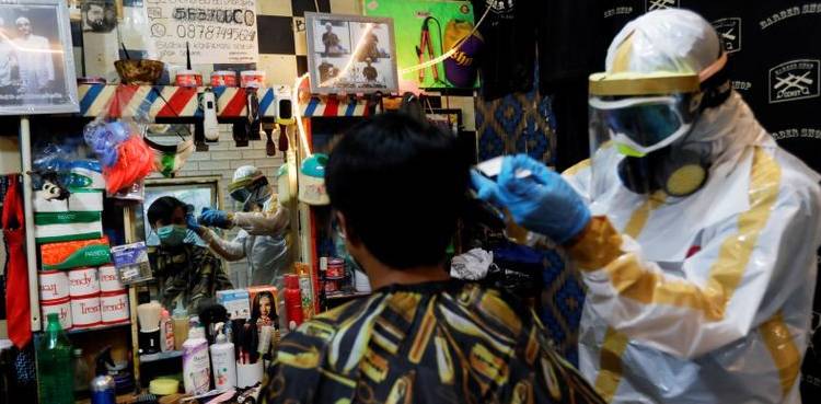 WATCH: Hairdresser gears up to groom during coronavirus