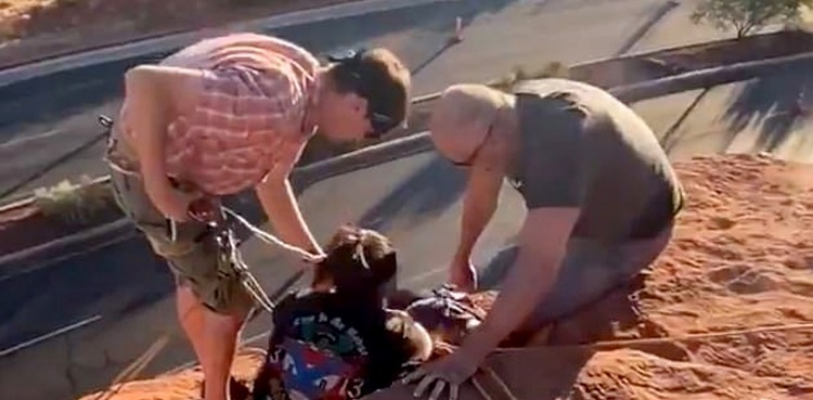 Football team rescues girl hanging from cliff, video goes viral