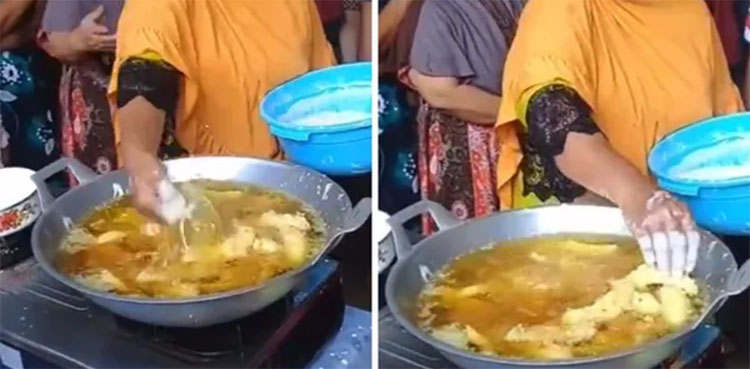 WATCH: Woman frying food in hot oil with bare hands baffles netizens