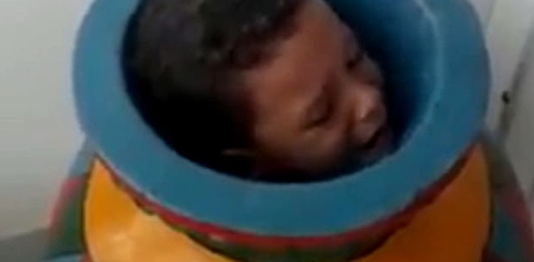Boy gets trapped in clay vase while playing at home