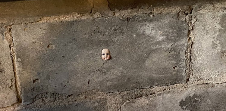 Watch: Woman discovers creepy doll hidden in wall of her new home