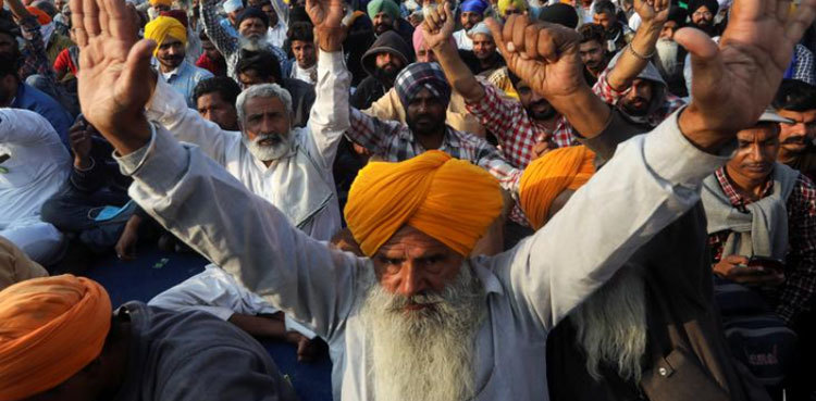 Indian police fire tear gas as protesting farmers march to capital