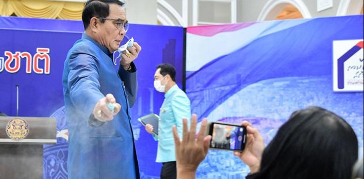 Irked Thai PM sprays reporters with hand sanitiser