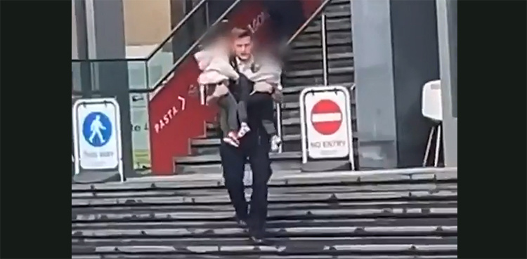 WATCH: 'Hero' cop rescues children from burning train station