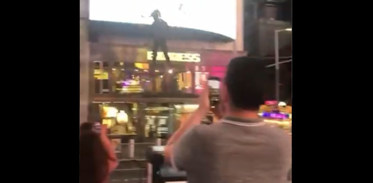 Man spotted flying around New York's Times Square, video goes viral
