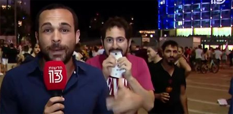 WATCH: Man performs magic trick behind reporter during live TV show