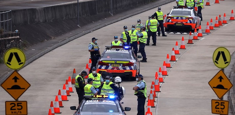 Australia reports record COVID-19 cases as police block Sydney protest