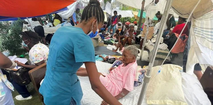 Distraught Haitians seek medical help at swamped hospitals after quake