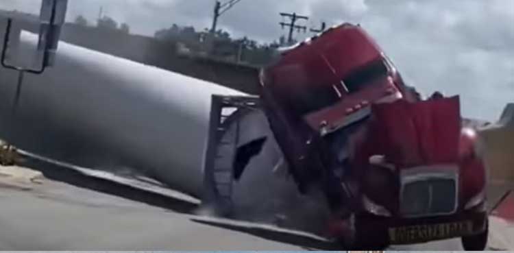 Horrific video shows train crashing into truck carrying wind turbines