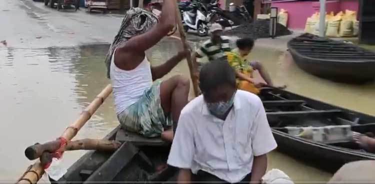 India: People travel on boats after heavy rainfall