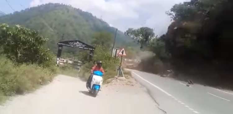 WATCH: Scooter driver, pillion escape landslide by seconds