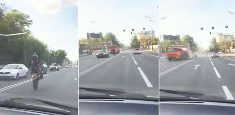 Viral video: Biker pulling off wheelie stunt crashes into tanker