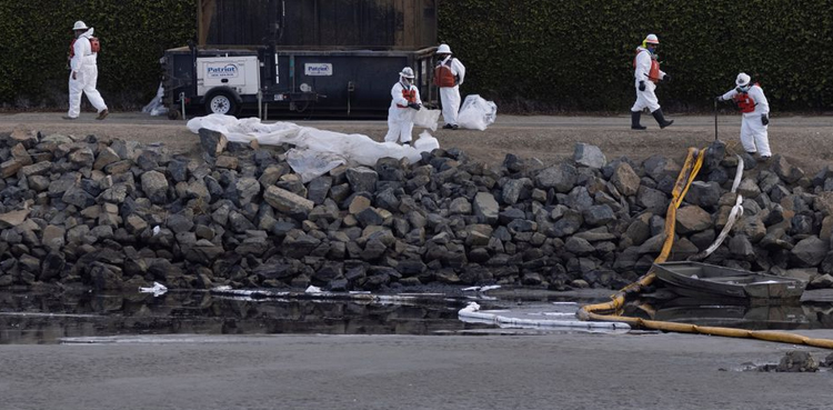 California oil spill cause probed; storm threatens cleanup