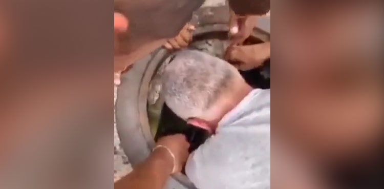 Watch: Store owner, worker rescue child who fell into manhole