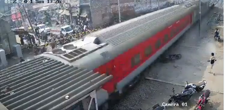Man nearly gets hit by train after bike falls on track, video goes viral