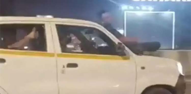 Video shows man sitting on bonnet of speeding car