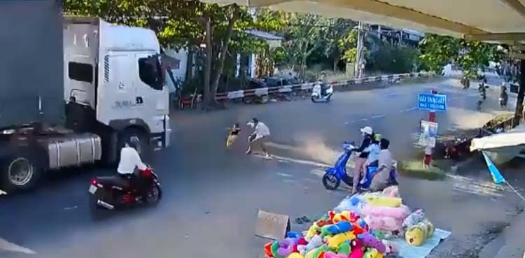 Viral video: Man saves child from approaching truck