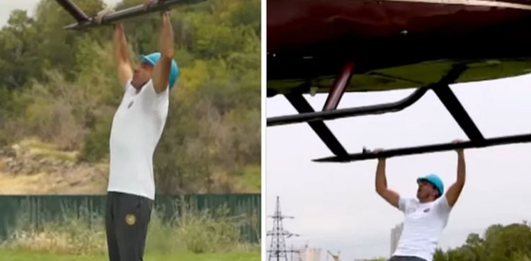 Viral video: Man does pull ups while hanging from helicopter to set GWR